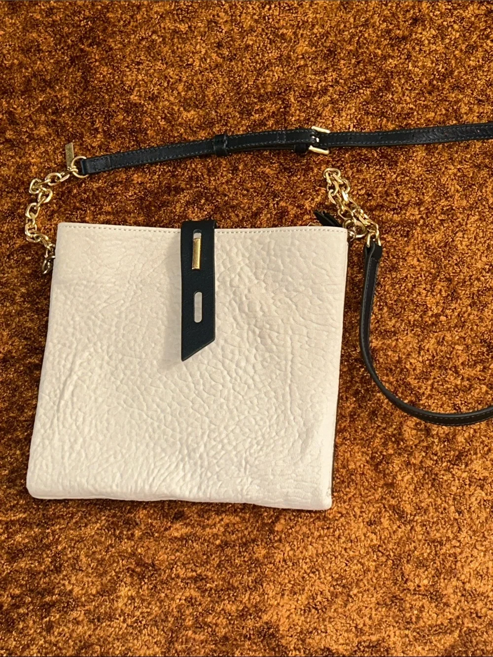Cream Crossbody Bag with Black Strap and Gold Chain Accent